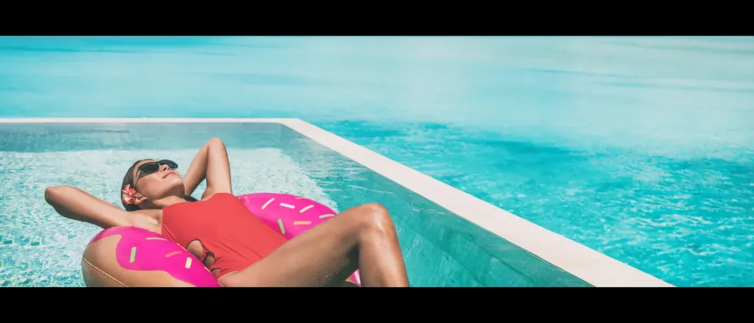 A woman lying on a float in a pool