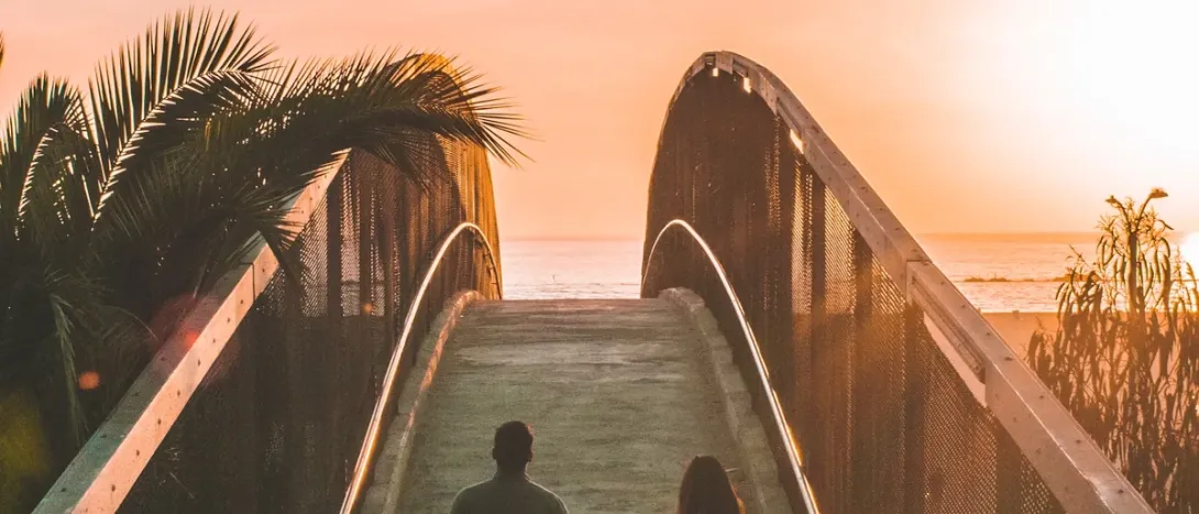 A path over a bridge towards the sea