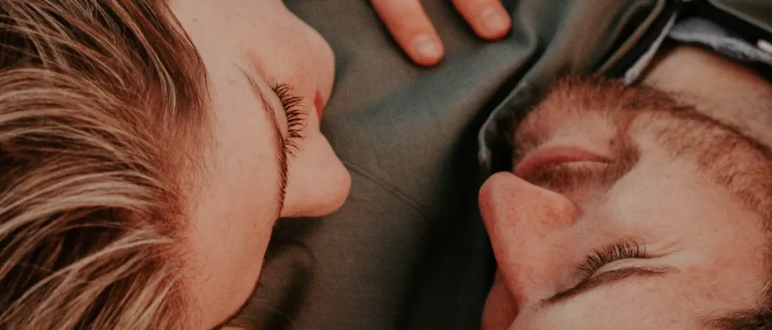 Two faces close together on a pillow